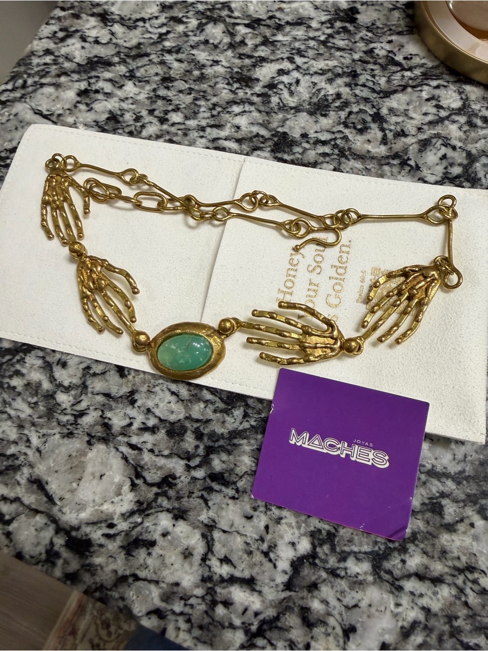 Brass/Bronze Skeleton Hand Necklace with Green Stone